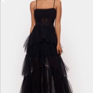 This is a gorgeous black, ruffle layers prom dress.
